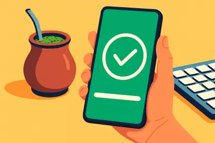 persona con smartphone junto a un mate argentino